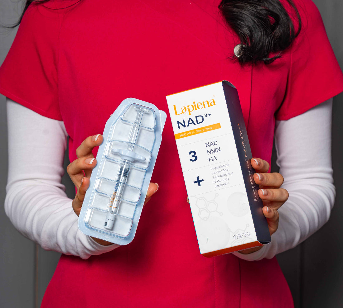 woman holding NAD+ product by Lapiena against a red background