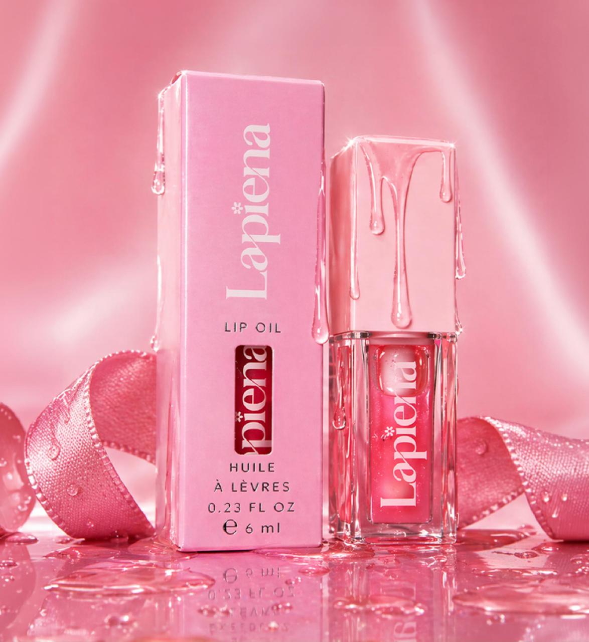 lip oil by lapiena with packaging on a pink background