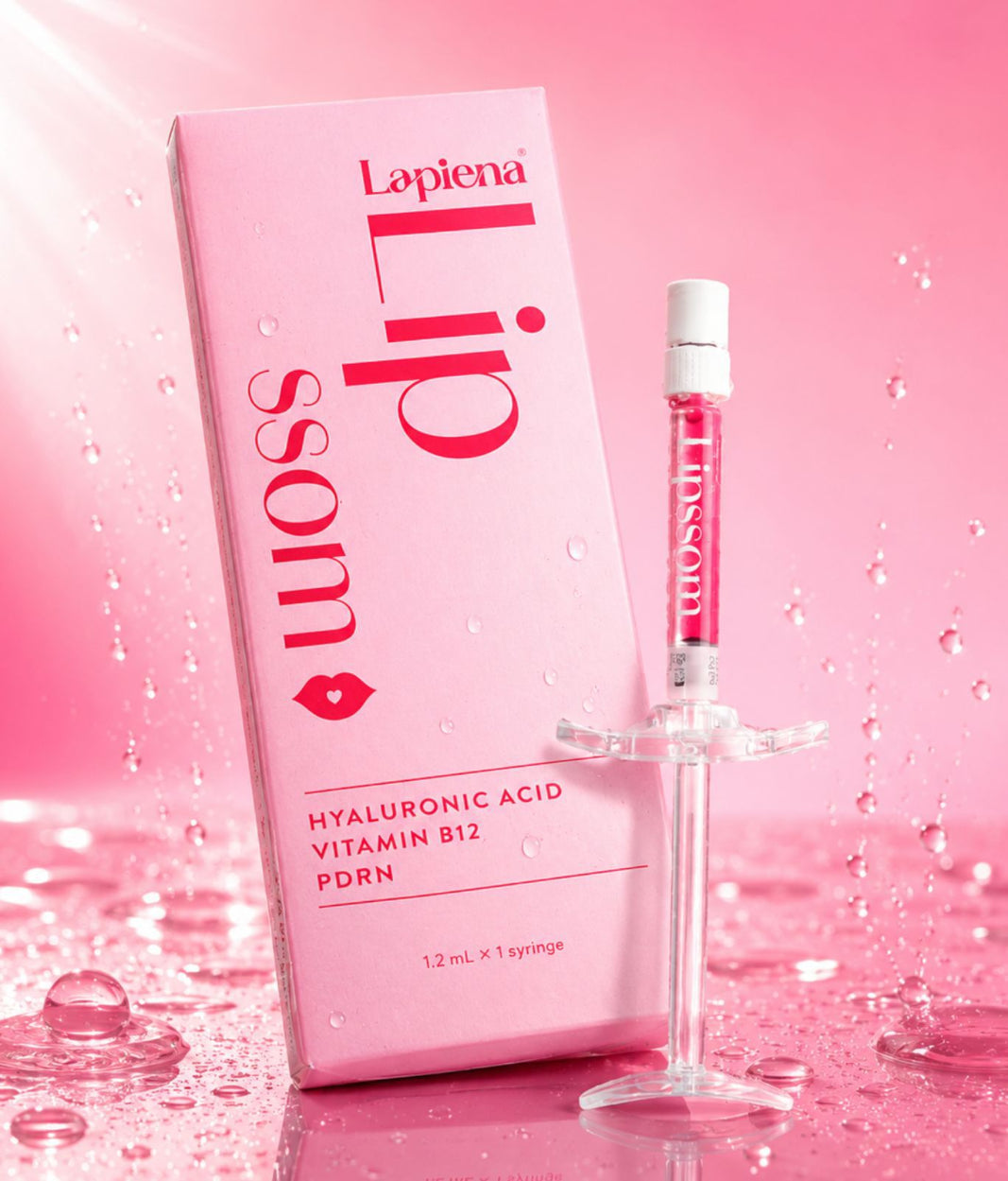 Lip Booster lipssom lip treatment with packaging on a pink background